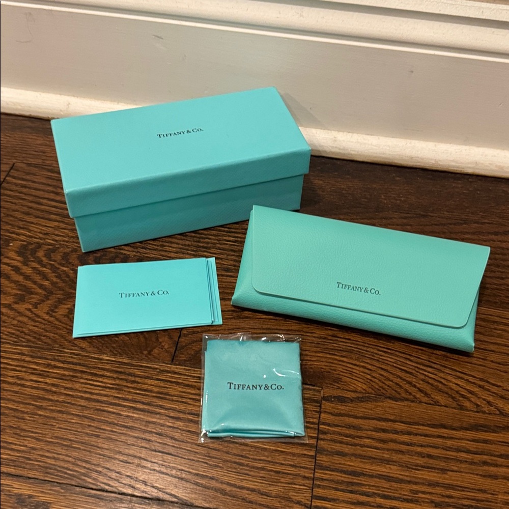 Tiffany sunglass case. Brand new never used. Comes with case, box and cloth.